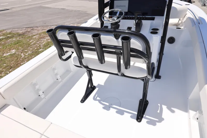 Slide: The Image of 2026 Sea Hunt Ultra 219 boat interior with rod holders and steering console. - 6