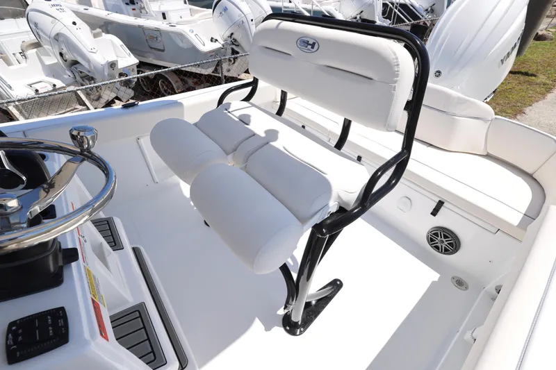 Slide: The Image of 2026 Sea Hunt Ultra 219 boat interior with white seating and steering wheel. - 7