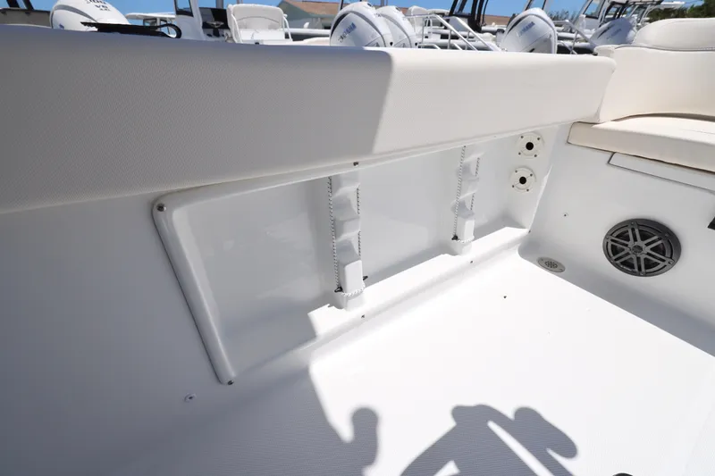 Slide: The Image of Interior view of 2026 Sea Hunt Ultra 219 boat, showcasing seating and speaker details. - 8