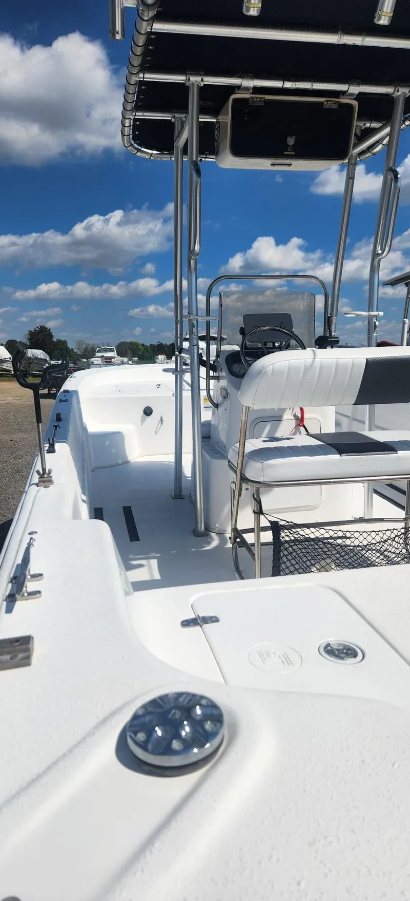 Slide: The Image of 2012 Carolina Skiff 218 DLV boat under blue sky. - 2