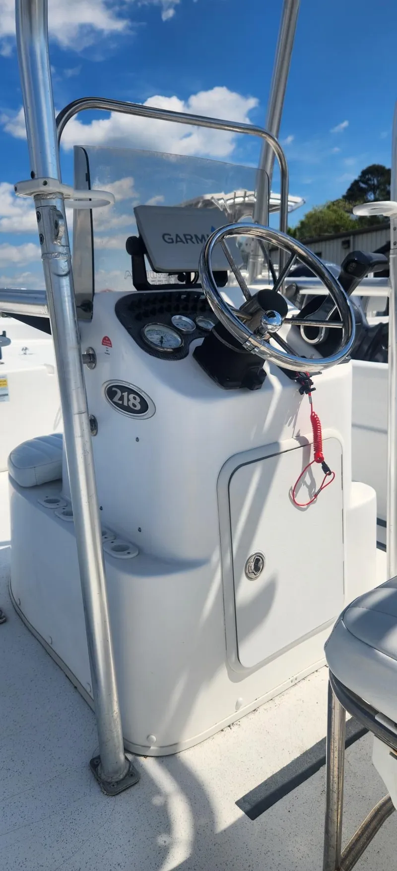 Slide: The Image of 2012 Carolina Skiff 218 DLV helm with Garmin device. - 3