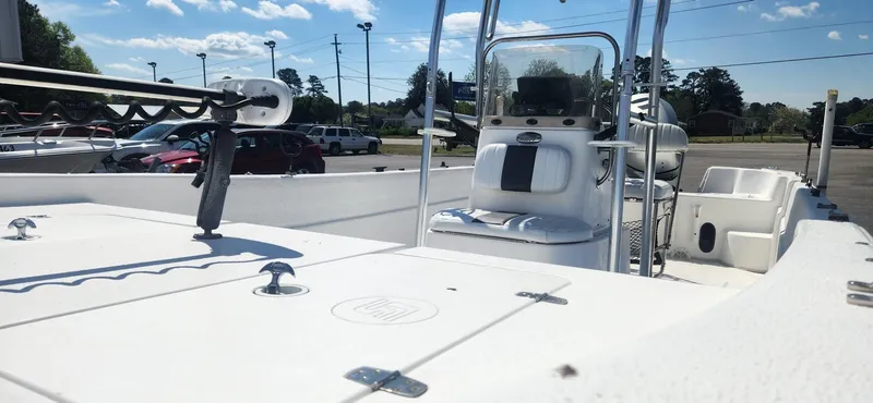 Slide: The Image of 2012 Carolina Skiff 218 DLV boat parked under sunny skies. - 5