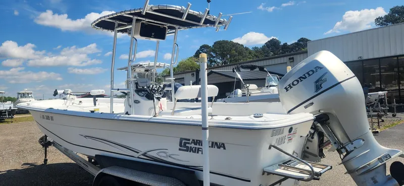 Slide: The Image of 2012 Carolina Skiff 218 DLV boat with Honda outboard motor. - 7