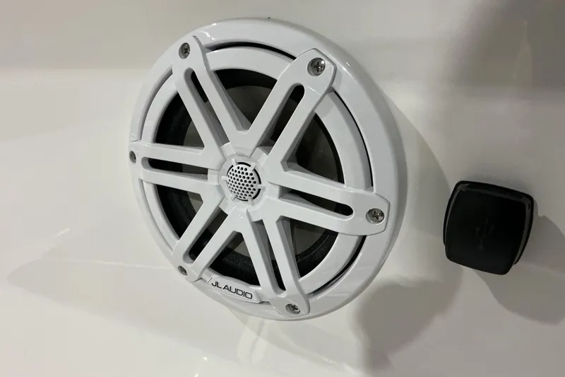 Slide: The Image of White JL Audio speaker on 2026 Monterey Elite 25 OB boat interior. - 23