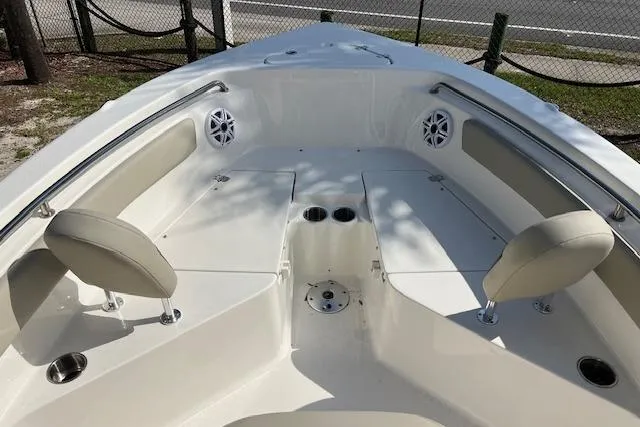 Slide: The Image of 2026 Key West 203 FS boat interior with seating and cup holders. - 11