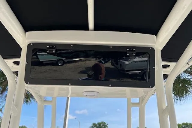 Slide: The Image of 2026 Key West 203 FS boat console with black panel and overhead view. - 6