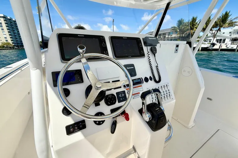Slide: The Image of Helm of 2014 Stamas 390 Tarpon boat with modern navigation equipment and controls. - 16