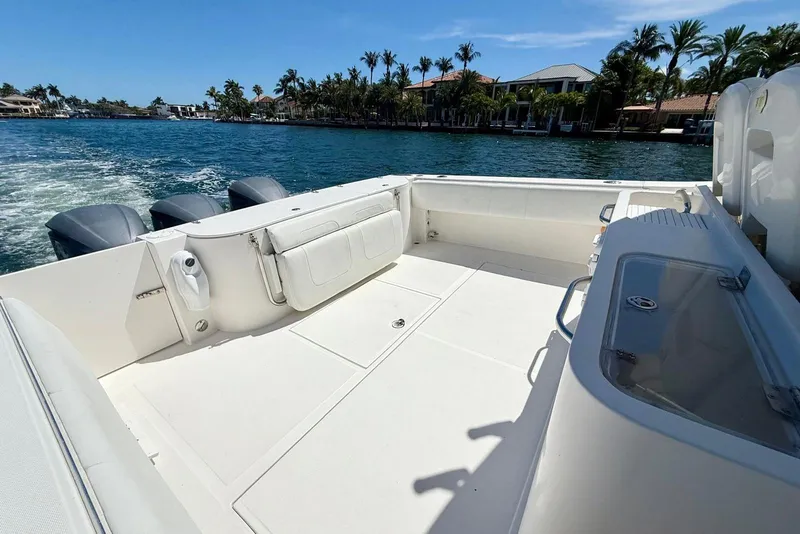 Slide: The Image of 2014 Stamas 390 Tarpon boat deck with triple engines, cruising on a sunny day. - 23