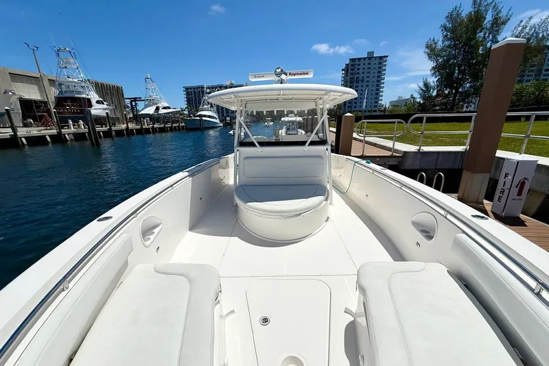 Slide: The Image of 2014 Stamas 390 Tarpon boat docked at marina, clear sky, modern design. - 25