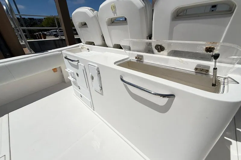Slide: The Image of 2014 Stamas 390 Tarpon boat interior with storage compartments and seating. - 36