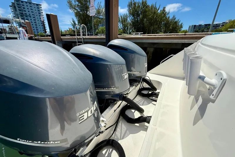 Slide: The Image of Triple Yamaha 300 outboard engines on a 2014 Stamas 390 Tarpon boat docked. - 37