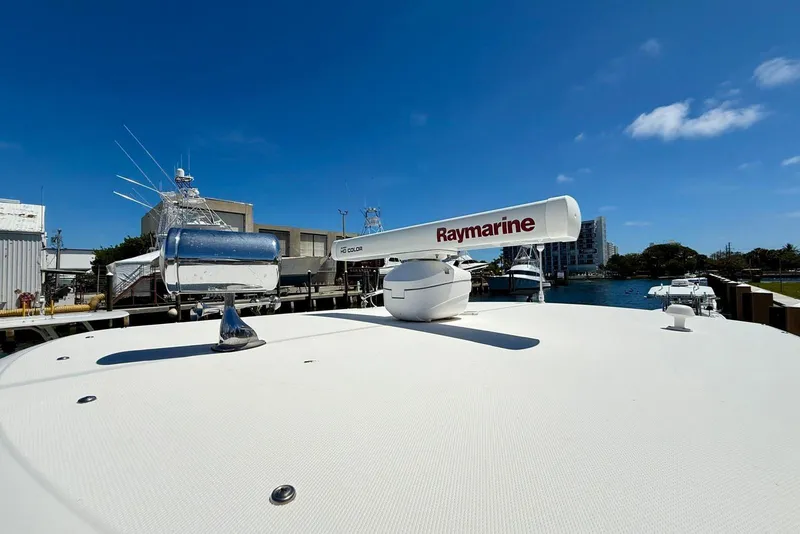 Slide: The Image of 2014 Stamas 390 Tarpon boat with Raymarine radar, docked under clear blue sky. - 38