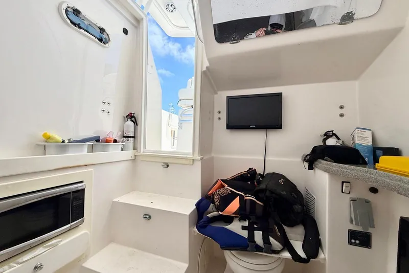 Slide: The Image of Interior of 2014 Stamas 390 Tarpon boat with equipment and small TV. - 41