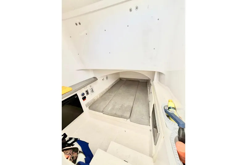 Slide: The Image of 2014 Stamas 390 Tarpon cabin interior with bed and storage compartments. - 42