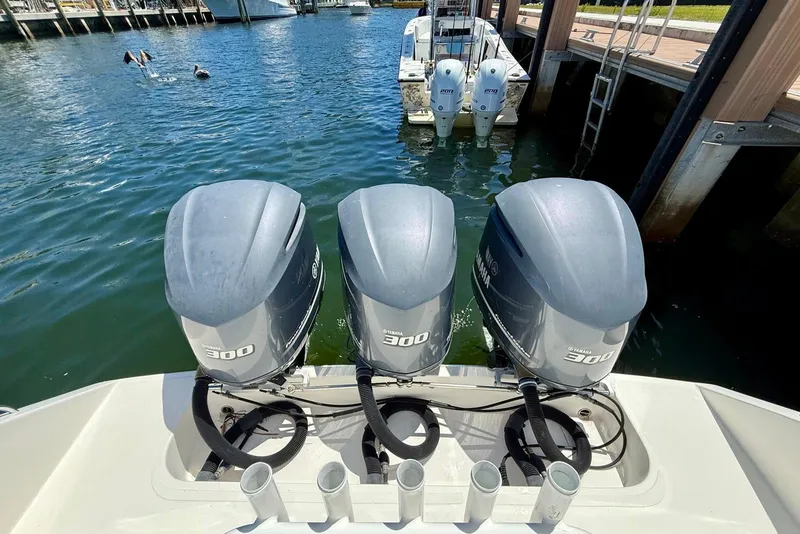 Slide: The Image of 2014 Stamas 390 Tarpon with triple Yamaha 300 engines docked at marina. - 43
