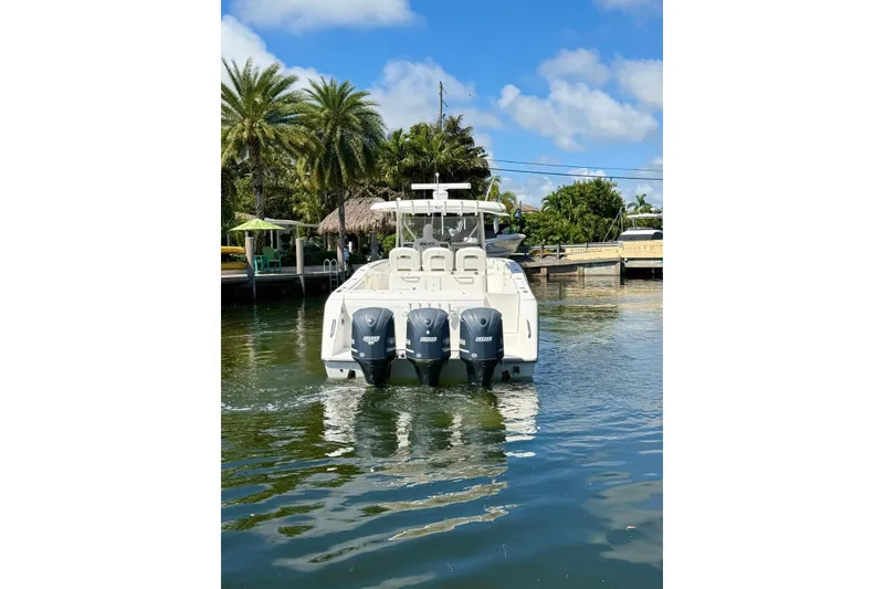 Slide: The Image of 2014 Stamas 390 Tarpon boat with triple engines on a sunny day. - 6
