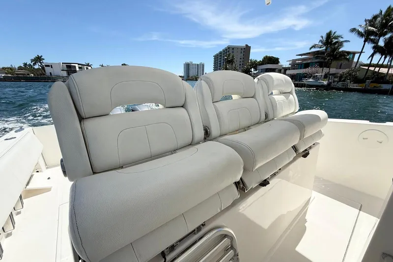 Slide: The Image of 2014 Stamas 390 Tarpon boat with plush seating, cruising on a sunny day. - 20