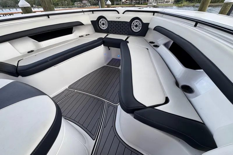 Slide: The Image of 2023 Tidewater 320 CC Adventure boat interior with sleek seating and modern design. - 20