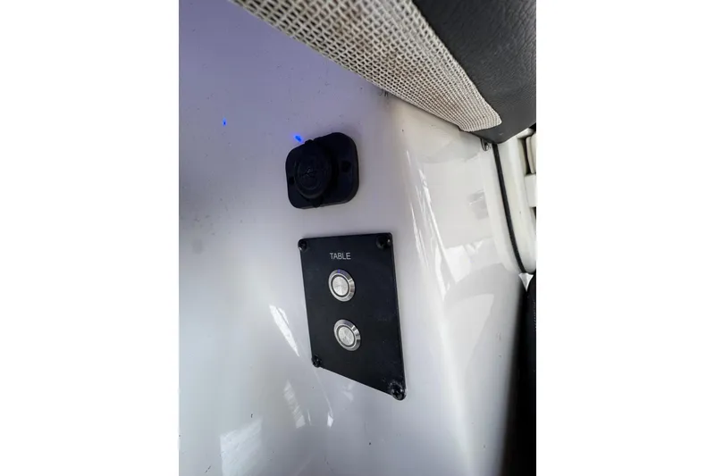 Slide: The Image of Control panel on 2023 Tidewater 320 CC Adventure boat interior. - 21