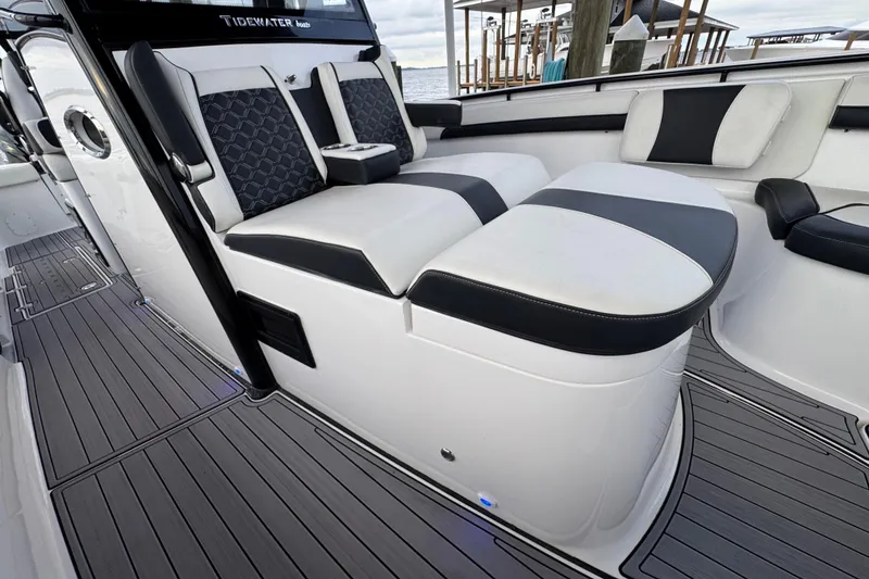 Slide: The Image of 2023 Tidewater 320 CC Adventure boat interior with sleek seating and modern design. - 22
