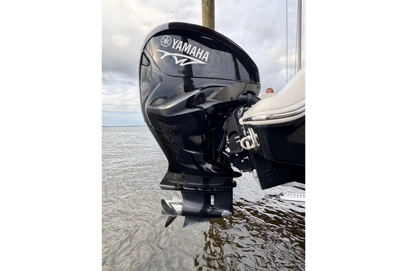 Slide: The Image of Outboard motor on 2023 Tidewater 320 CC Adventure boat, featuring Yamaha branding. - 27