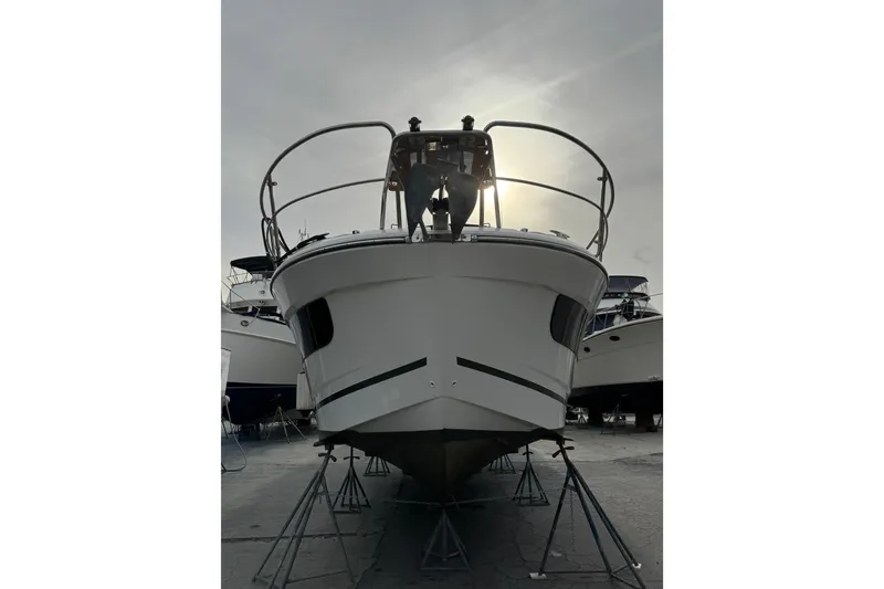 Slide: The Image of 2021 Jeanneau NC Weekender 1095 boat on stands, viewed from the front. - 11