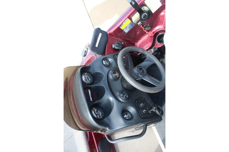 Slide: The Image of Dashboard of a 2002 Nitro NX 882 DC boat with steering wheel and gauges. - 13