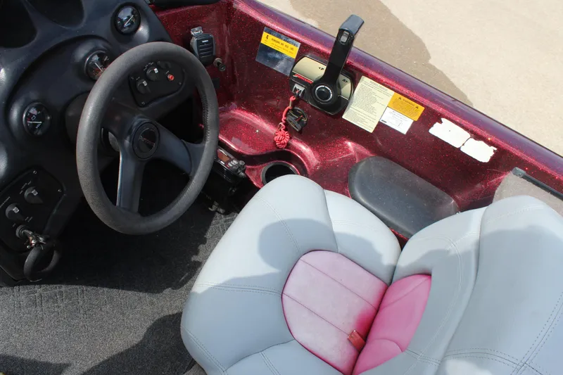 Slide: The Image of Interior of a 2002 Nitro NX 882 DC boat with steering wheel and seat. - 14