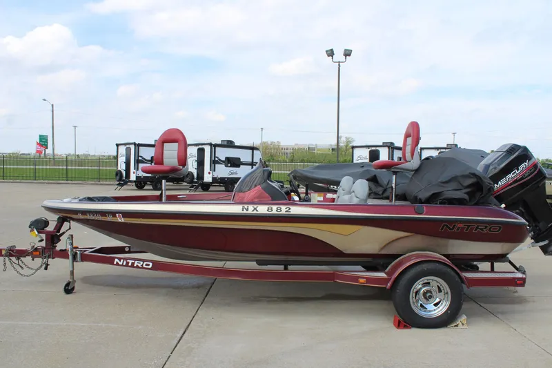 Slide: The Image of 2002 Nitro NX 882 DC boat on trailer, parked outdoors. - 4