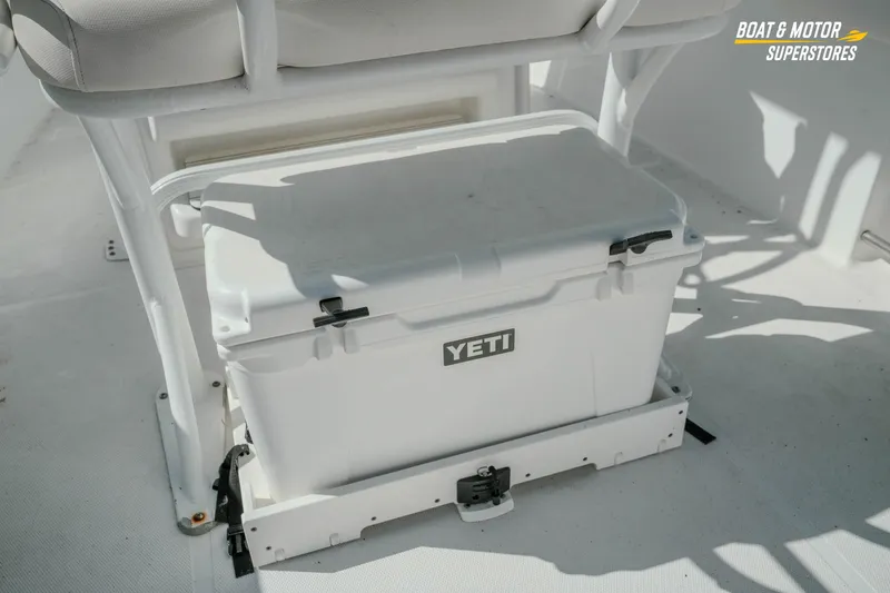 Slide: The Image of YETI cooler on 2021 Sea Hunt Ultra 229 boat deck, Boat & Motor Superstores. - 11