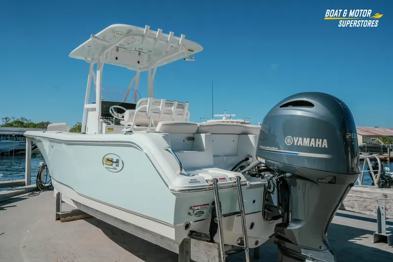 Slide: The Image of 2021 Sea Hunt Ultra 229 boat with Yamaha engine at dockside. - 2