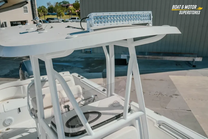 Slide: The Image of 2021 Sea Hunt Ultra 229 boat with T-top and LED light bar. - 25