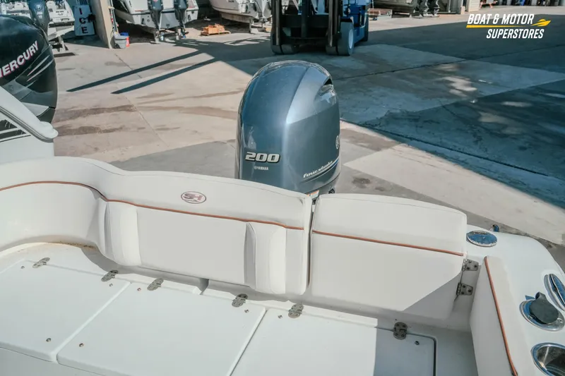 Slide: The Image of 2021 Sea Hunt Ultra 229 boat with Yamaha 200 engine at dealership. - 30