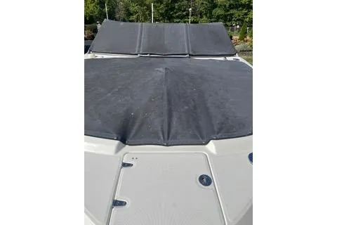 Slide: The Image of 2008 Chaparral Sunesta 224 boat with covered deck, outdoors. - 14