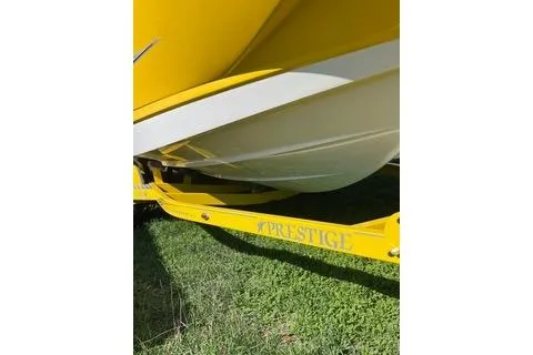 Slide: The Image of 2008 Chaparral Sunesta 224 boat on yellow Prestige trailer, parked on grass. - 15