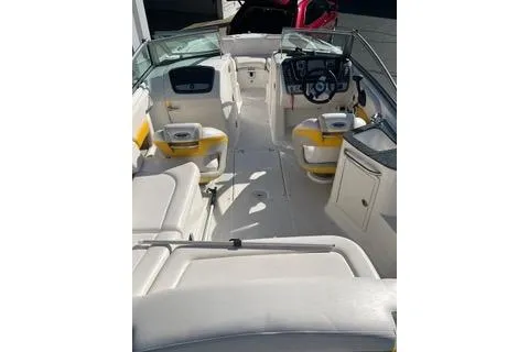 Slide: The Image of 2008 Chaparral Sunesta 224 boat interior with white and yellow seating. - 3