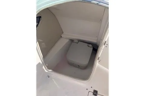 Slide: The Image of 2008 Chaparral Sunesta 224 boat interior with storage compartment. - 7