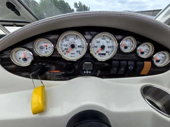 Slide: The Image of Dashboard of a 2008 Stingray 205 LS/LX/LR boat with gauges and controls. - 10