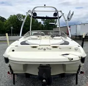 Slide: The Image of 2008 Stingray 205 LS/LX/LR boat, rear view, parked outdoors. - 3