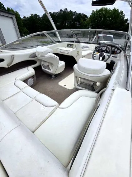 Slide: The Image of 2008 Stingray 205 LS/LX/LR boat interior with white seating and steering console. - 5