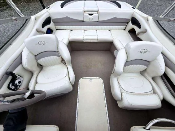 Slide: The Image of 2008 Stingray 205 LS/LX/LR boat interior with white leather seating and steering wheel. - 6