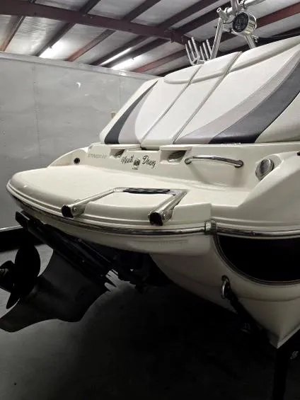 Slide: The Image of 2008 Stingray 205 LS/LX/LR boat rear view with swim platform and ladder. - 9
