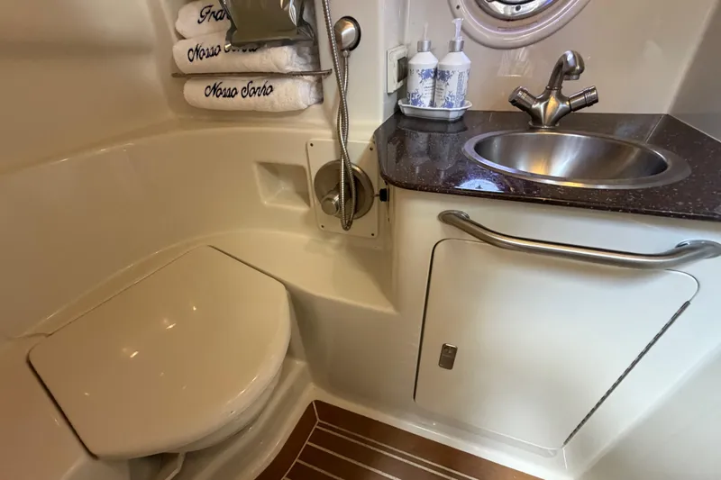 Slide: The Image of Luxurious bathroom in 2012 Sea Ray Sundancer 350 yacht with sink, toilet, and towels. - 15