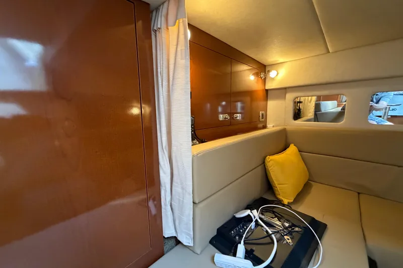 Slide: The Image of Interior of 2012 Sea Ray Sundancer 350 yacht with cozy seating and modern lighting. - 18