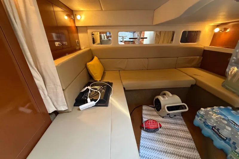 Slide: The Image of Interior of 2012 Sea Ray Sundancer 350 yacht with cozy seating and modern amenities. - 19