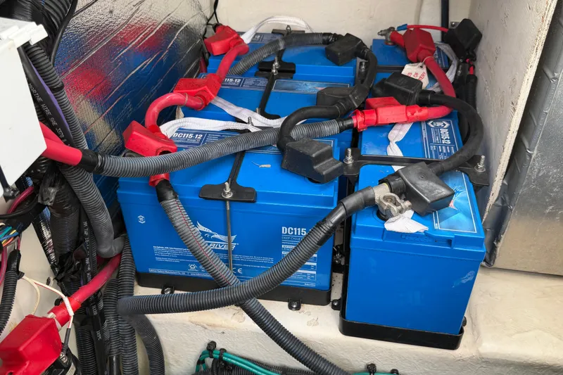 Slide: The Image of Batteries and wiring in a 2012 Sea Ray Sundancer 350 boat engine compartment. - 31