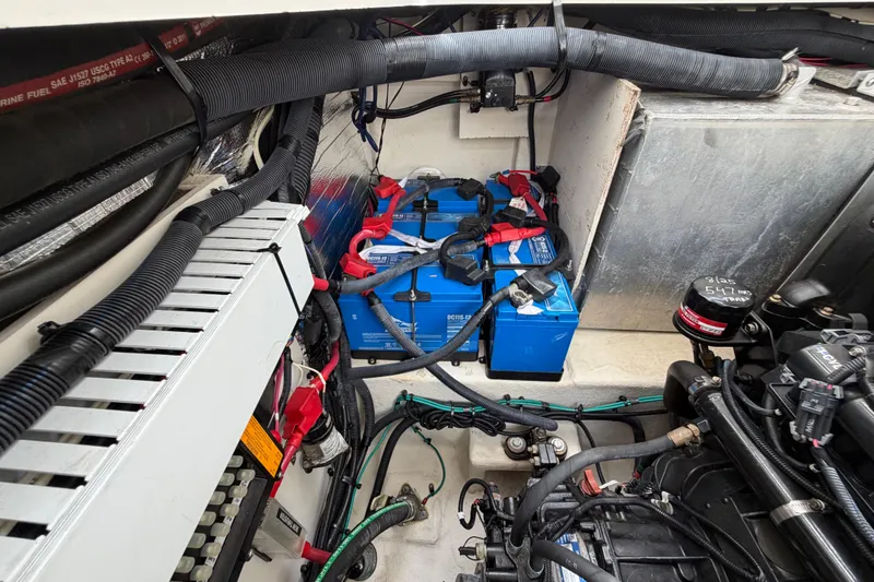 Slide: The Image of Engine compartment of 2012 Sea Ray Sundancer 350 with batteries and wiring. - 32