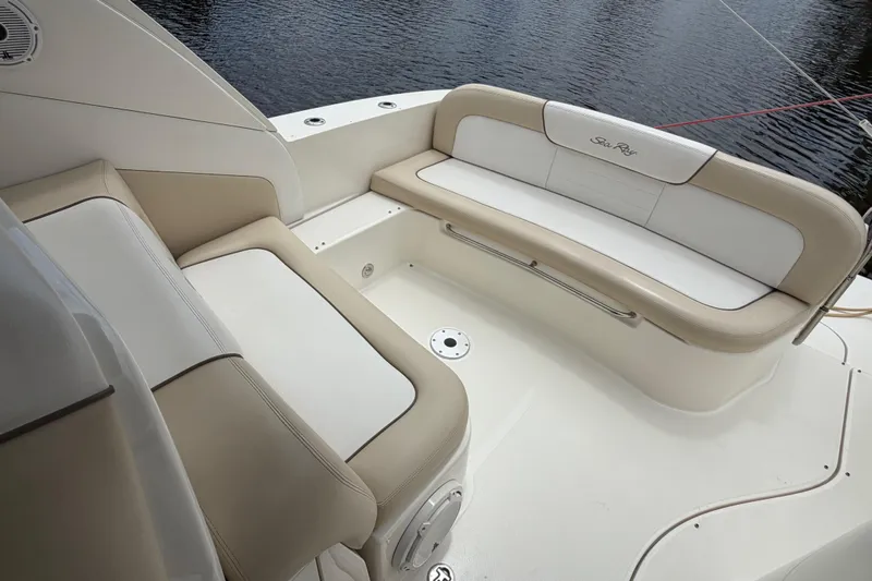 Slide: The Image of 2012 Sea Ray Sundancer 350 boat seating area with beige and white upholstery. - 45