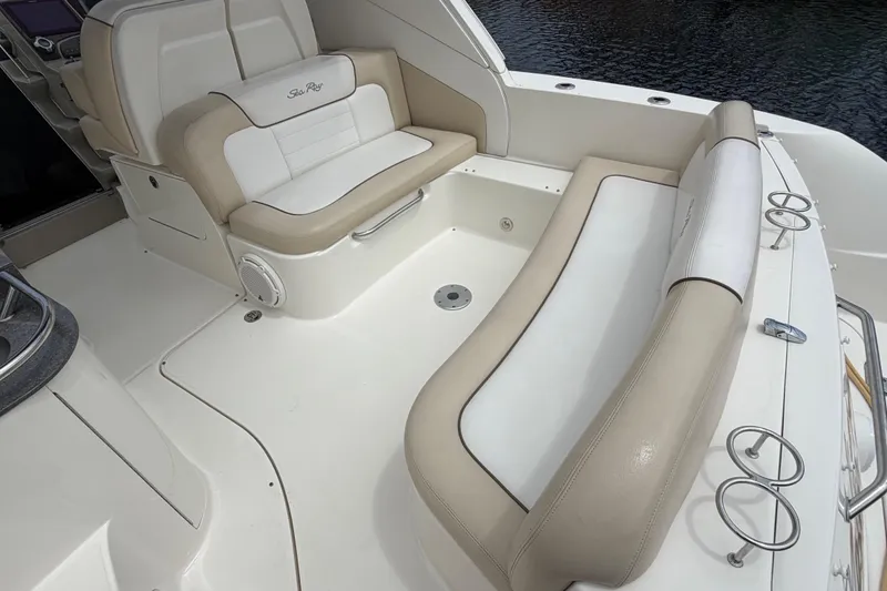 Slide: The Image of 2012 Sea Ray Sundancer 350 boat interior with beige and white seating. - 46