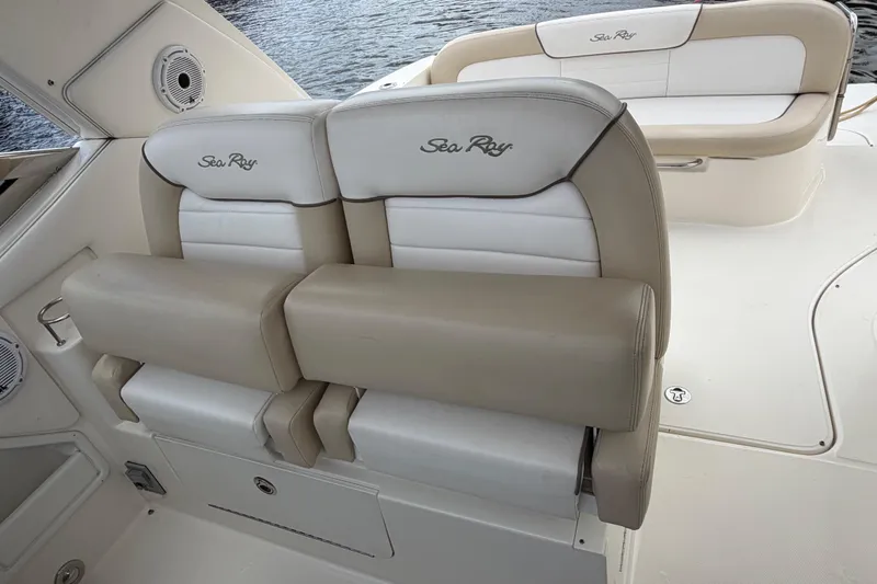 Slide: The Image of 2012 Sea Ray Sundancer 350 boat interior with beige and white seating. - 52